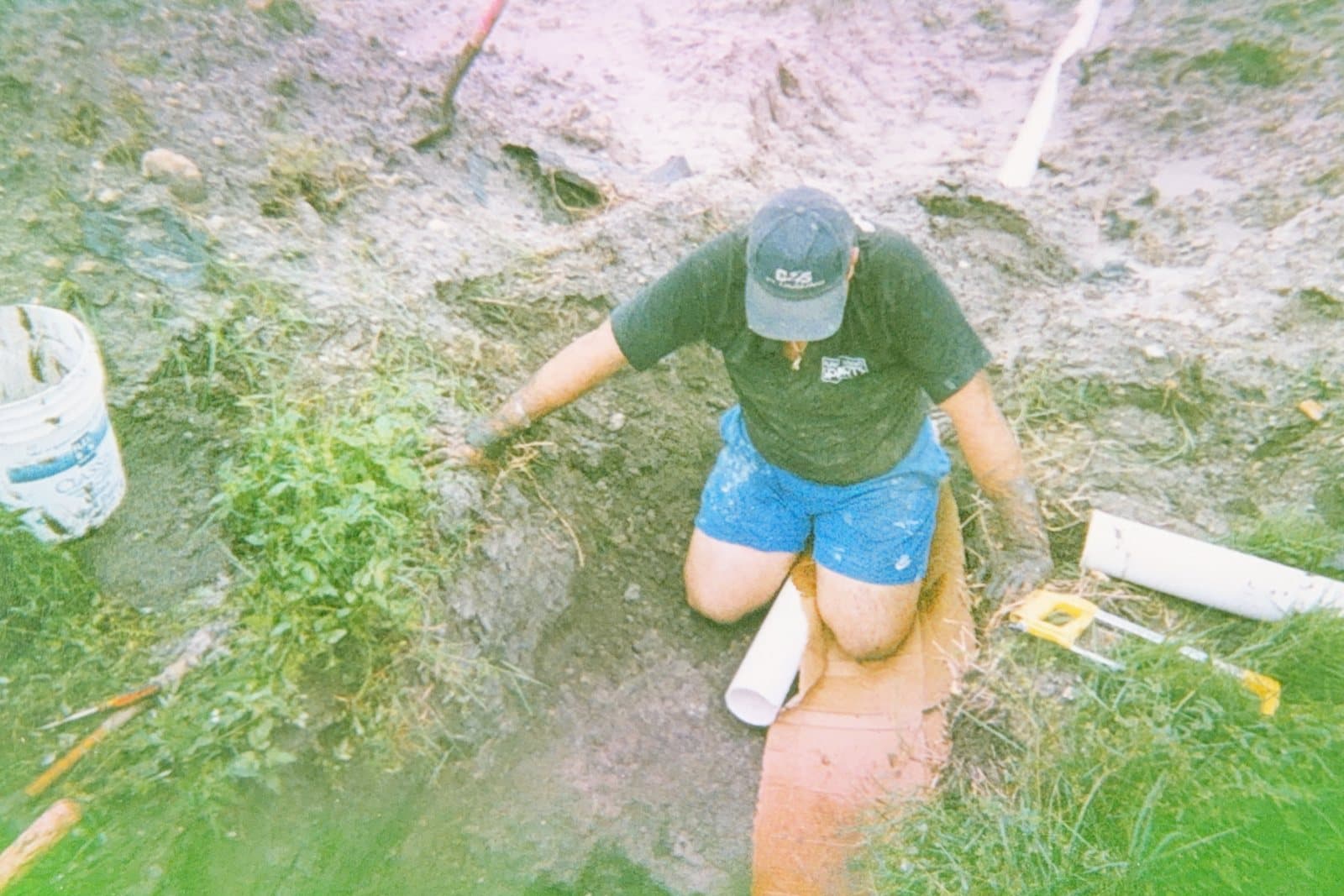 Sam Pellechio Jr. running underground plumbing on a job site in the early 2000s