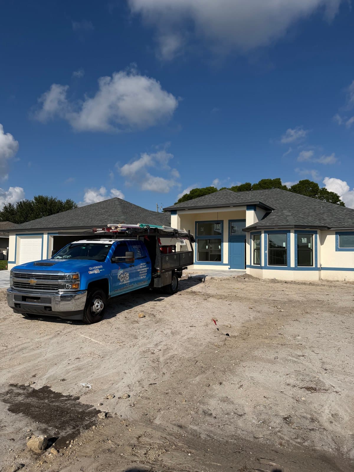A C&S Plumbing of Lee truck at a new-construction home in Southwest Florida